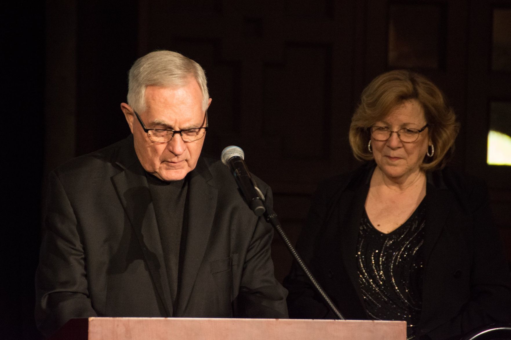 Monsignor Josef Simon gives the blessing before dinner.